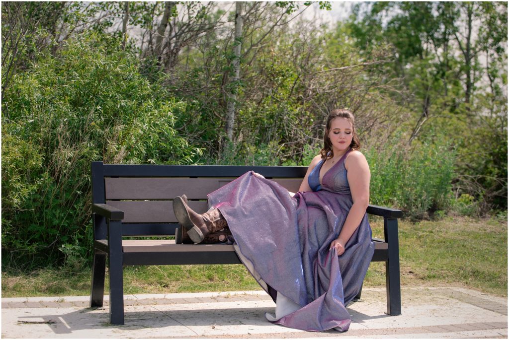 dalmeny saskatchewan 2020 graduation session, graduate sitting on a bench