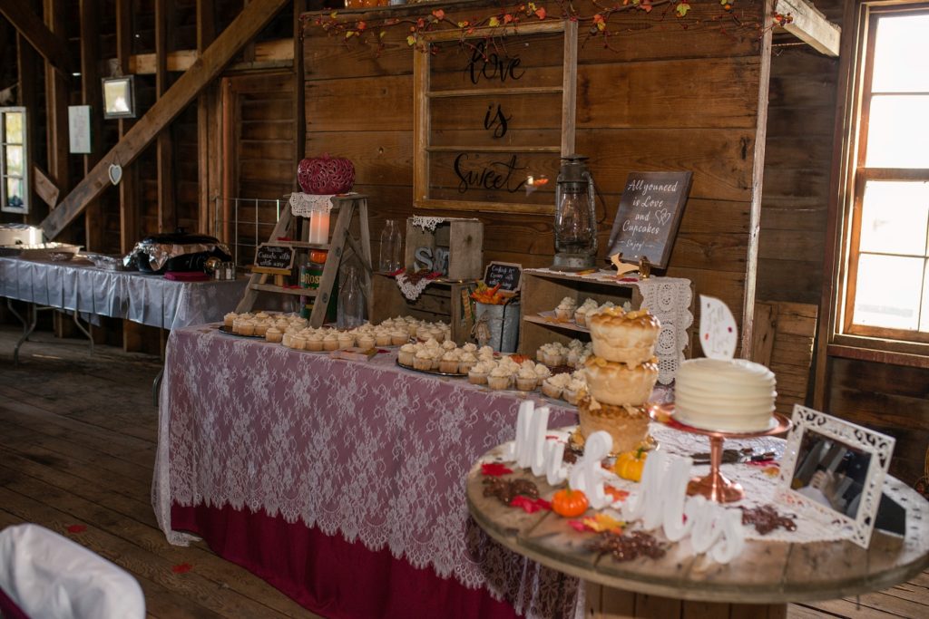 wedding dessert table at barn reception