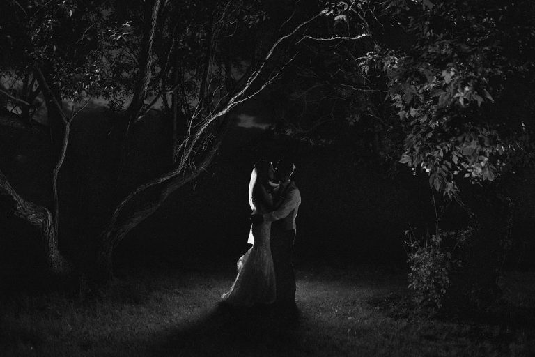 bride and groom formal black and white portrait, shot after sunset