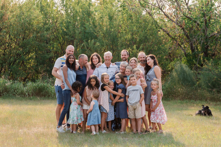 large extended family group hug